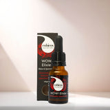 Wow! Elixier von cobicos in brauner Pipettenflasche steht vor schwarzem Karton mit roter Granatapfel-Illustration